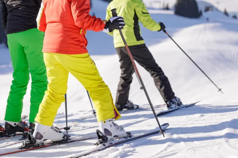 man and woman skiing and snowboarding in the mountains, ski resort
