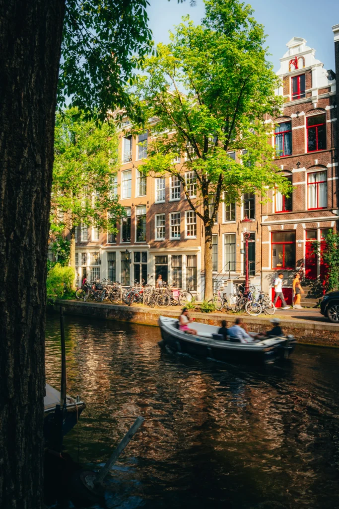 Amsterdam canal lined with historic houses and bicycles